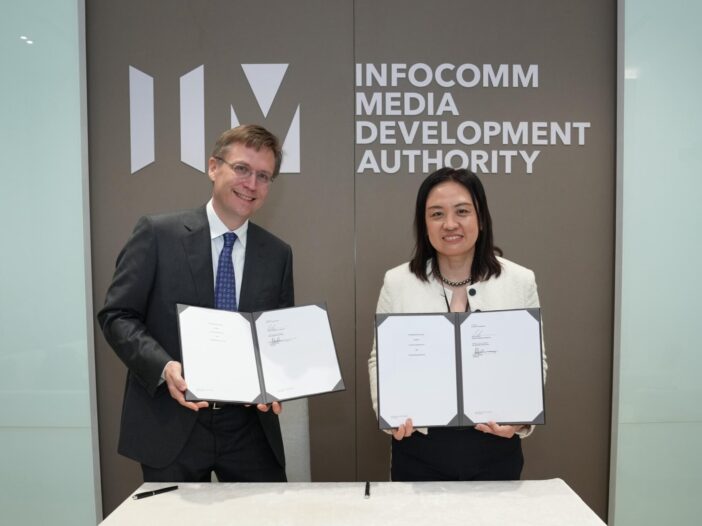 Dr Peter Mattson, MlCommons and Dr Ong Chen Hui AI Verify sign a MOI to work on AI Safety